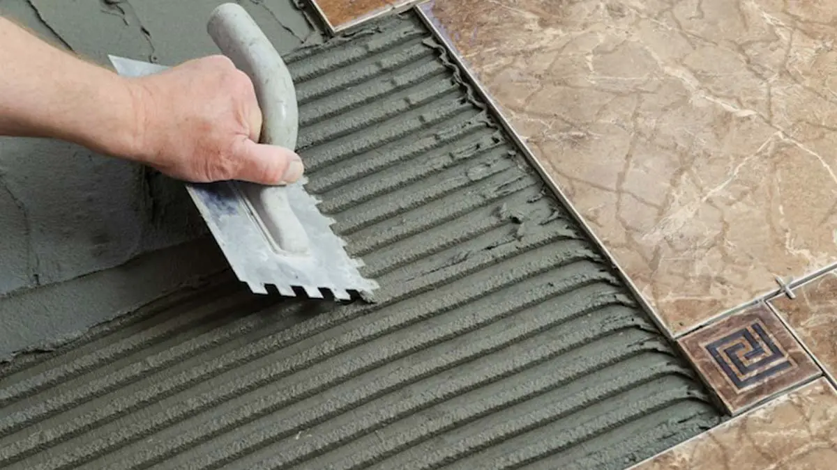 preparing concrete floor to lay tile
