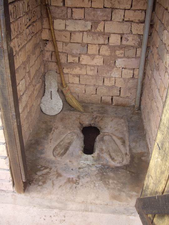 Adobe wall in pit latrine